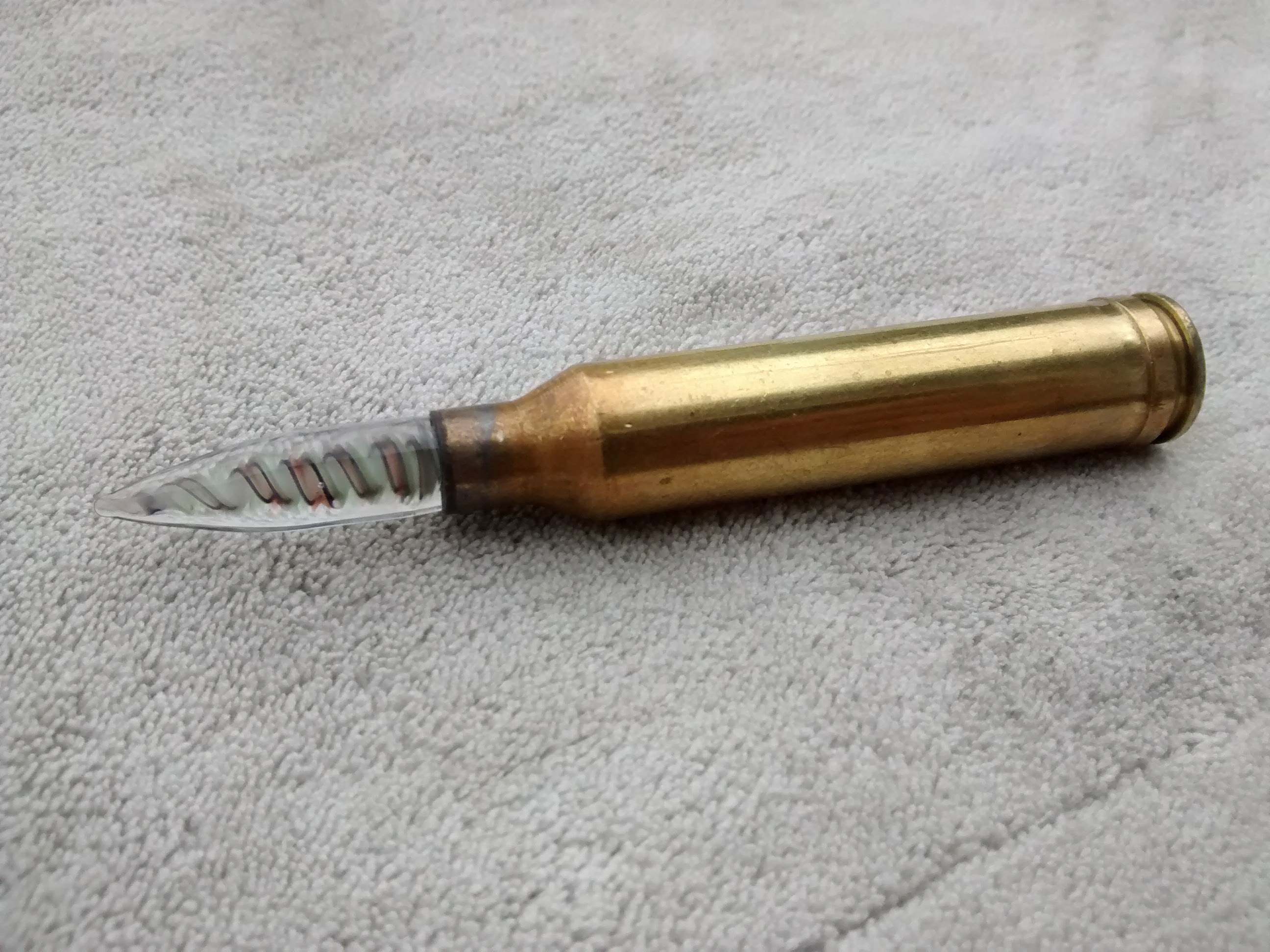 glass dabber Bullet 7mm Rem Mag ammo.